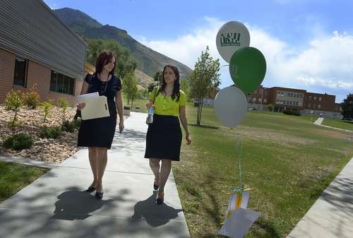 Scott Sommerdorf   |  The Salt Lake Tribune
Communications Director Liz Sollis, left, and Ginger Phillips who is a former patient and now advocate for the hospital walk on the campus of the Utah State Hospital during a tour of the new Mountain Springs Pediatric Treatment Center and Mark I. Payne Buildings in Provo, Thursday, June 12, 2014.