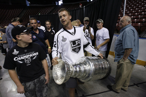 Francisco Kjolseth  |  The Salt Lake Tribune
Trevor Lewis, who played hockey for Brighton High School, brings the Stanley Cup home for a day as a member of the NHL champion Los Angeles Kings. Thousands of fans lined up at the Maverik Center in West Valley City on Thursday, August 30, 2012, for a chance to pose for a picture with Lewis and the Cup.
