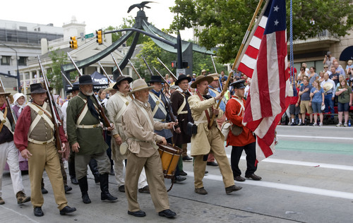 Al Hartmann  |  The Salt Lake Tribune
True to tradition the Mormon Battalion starts the Days of 47 Parade with the American flag and Utah state flag in downtown Salt Lake City Wednesday July 24.