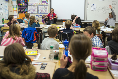Chris Detrick  |  The Salt Lake Tribune
Students listen as Alison Stuart speaks during Mike Sorensen's fifth-grade class at Highland Park Elementary School Thursday May 8, 2014.