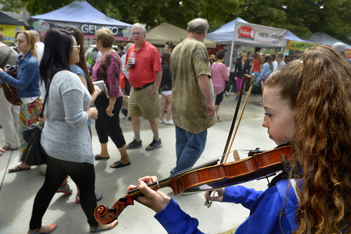 Scott Sommerdorf  |  The Salt Lake Tribune
Jessica Limb plays her violin at Pioneer Park on Saturday at the opening day of the 2014 Downtown Farmers Market.