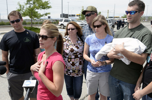 Al Hartmann  |  The Salt Lake Tribune
Elizabeth Krmpotich, younger sister of of slain Las Vegas Police officer Alyn Beck, talks to the media as the family waits for his body to be unloaded from plane at Salt Lake City International Airport Sunday June 15, 2014.  His hearse and the family were escorted to the Wyoming border along I-80 by an honor guard of Idaho and Utah motorcycle patrolmen.