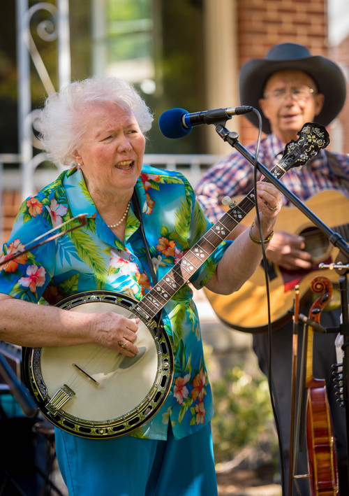 Trent Nelson  |  The Salt Lake Tribune
Kathryn Goates and Wayne Hovey of the Second Story Band perform on a Sugar House front lawn as part of the 20th annual Heart & Soul Music Stroll in Salt Lake City, Saturday June 14, 2014. More than 30 bands  performed on porches, sponsored by the Utah nonprofit Heart & Soul, which takes music and performing arts to isolated people.