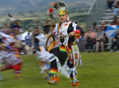 Scott Sommerdorf   |  The Salt Lake Tribune
A dancer blurs with the music during the teen men's dance at the Heber Valley Pow-Wow at Soldier Hollow, Sunday, June 15, 2014.