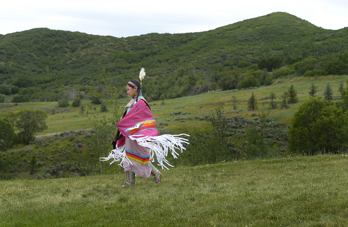 Scott Sommerdorf   |  The Salt Lake Tribune
Keva Dann, of Fort Hall, Idaho, walks back to the dancing circle after practicing her dance at the Heber Valley Pow-Wow at Soldier Hollow, Sunday, June 15, 2014.