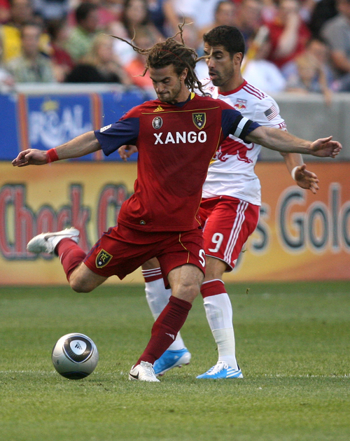 Real Salt Lake's Kyle Beckerman kicks the ball in front of the New York Red Bulls' Juan Pablo Angel during the first half of an MLS soccer match in Sandy, Utah, on Saturday, Sept. 4, 2010. (AP Photo/The Deseret News, Kristin Murphy)  SALT LAKE TRIBUNE OUT; PROVO DAILY HERALD OUT; MAGS OUT; NO SALES