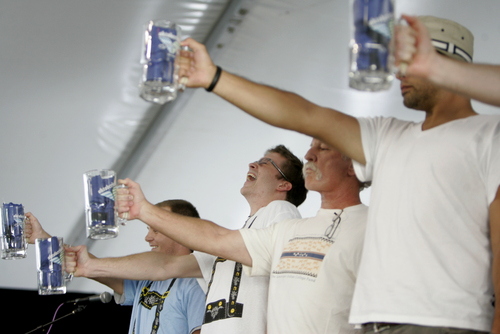 Kim Raff | The Salt Lake Tribune
(middle) Morgan Smith struggles to hold up his beer stein during a stein holding contest during Snowbird's 40th annual Oktoberfest Celebration at Snowbird Ski Resort  on August 18, 2012.