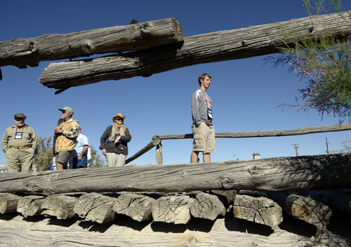 Al Hartmann  |  The Salt Lake Tribune
Members of the Lincoln Highway Association walk one of the last wooden bridges on the highway which still stands on Dugway Proving Grounds.  A group of about 100 visited the site Wednesday June 18.
