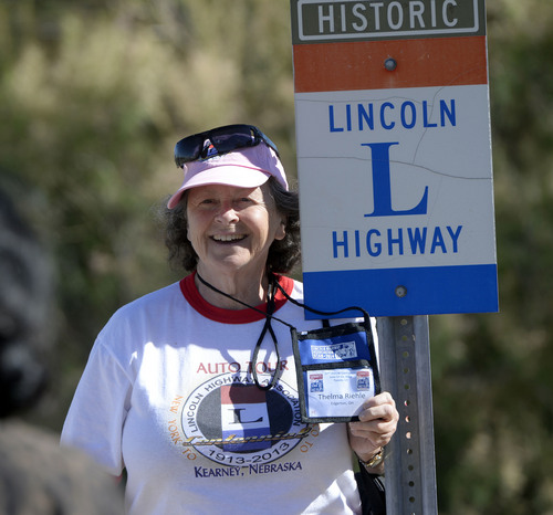 Al Hartmann  |  The Salt Lake Tribune
Thelma Riehle of Edgerton, Ohio, poses for a photo by a historic Lincoln HIghway marker.  Members of the Lincoln Highway Association walk one of the last original wooden bridges on the highway which still stands on Dugway Proving Grounds.  A group of about 100 visited the site Wednesday June 18.