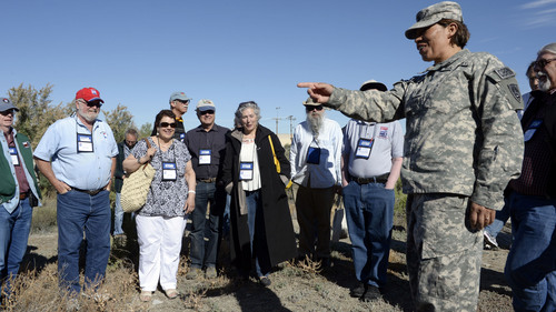 Al Hartmann  |  The Salt Lake Tribune
Command Sgt. Major Alma Zeladaparedes talks to members of the Lincoln Highway Association at one of the last original wooden bridges on the highway which still stands on Dugway Proving Grounds.  A group of about 100 visited the site Wednesday June 18.