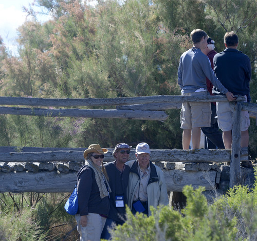 Al Hartmann  |  The Salt Lake Tribune
Members of the Lincoln Highway Association walk one of the last original wooden bridges on the highway which still stands on Dugway Proving Grounds.  A group of about 100 visited the site Wednesday June 18.