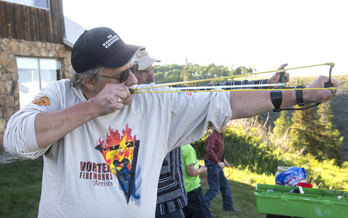 Rick Egan  |  The Salt Lake Tribune

Robert Kirby shoots gum balls out of his sling-shot at the Tavaputs Ranch Saturday, June 14, 2014