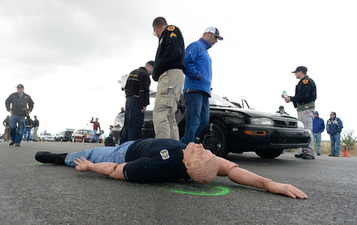 Francisco Kjolseth  |  The Salt Lake Tribune
Investigators seeking accident reconstructionist accreditation spend several hundred hours mastering relevant math and engineering concepts. During a demonstration in west Salt Lake on Wednesday, June 18, 2014, instructors use crash test dummies to showcase pedestrian injuries and vehicle damages that occur in auto-pedestrian crashes.