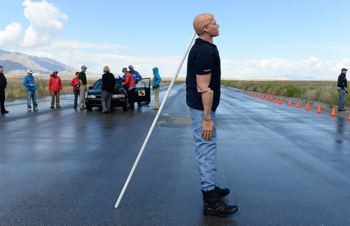 Francisco Kjolseth  |  The Salt Lake Tribune
A crash test dummy is prepared for another violent impact. Investigators seeking accident reconstructionist accreditation spend several hundred hours mastering relevant math and engineering concepts. During a demonstration in West Salt Lake on Wednesday, June 18, 2014, instructors use crash test dummies to showcase pedestrian injuries and vehicle damages that occur in auto-pedestrian crashes.