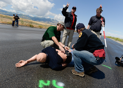 Francisco Kjolseth  |  The Salt Lake Tribune
Investigators seeking accident reconstructionist accreditation spend several hundred hours mastering relevant math and engineering concepts. During a demonstration in West Salt Lake on Wednesday, June 18, 2014, instructors use crash test dummies to showcase pedestrian injuries and vehicle damages that occur in auto-pedestrian crashes.