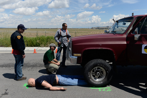 Francisco Kjolseth  |  The Salt Lake Tribune
Investigators seeking accident reconstructionist accreditation spend several hundred hours mastering relevant math and engineering concepts. During a demonstration in West Salt Lake on Wednesday, June 18, 2014, instructors use crash test dummies to showcase pedestrian injuries and vehicle damages that occur in auto-pedestrian crashes.