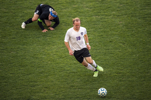 Chris Detrick  |  The Salt Lake Tribune
Riverton's Hunter McFall (19) and Fremont's Brayden Searle (3) go for the ball during the 5A Championship game at Rio Tinto Stadium Thursday May 22, 2014.