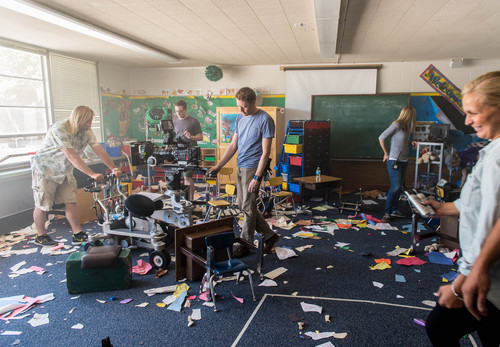 Trent Nelson  |  The Salt Lake Tribune
Film crew in a ransacked classroom during the filming of a movie based on the Cokeville Elementary School hostage crisis of 1986. Scenes for the movie were being filmed at Whitesides Elementary in Layton, Thursday June 19, 2014. Some of the actual survivors are taking part in the filming, and some (and some of their kids) are in the movie.
