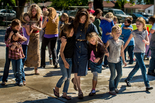 Trent Nelson  |  The Salt Lake Tribune
Extras rehearse a scene during the filming of a movie based on the Cokeville Elementary School hostage crisis of 1986. Scenes for the movie were being filmed at Whitesides Elementary in Layton on Thursday. Some of the actual survivors are taking part in the filming, and some (and some of their kids) are in the movie.