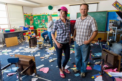 Trent Nelson  |  The Salt Lake Tribune
Lori Conger and Kamron Wixom, two survivors of the Cokeville Elementary School hostage crisis in 1986, pose in a ransacked classroom during the filming of a movie based on the event. Scenes for the movie were being filmed at Whitesides Elementary in Layton, Thursday June 19, 2014.