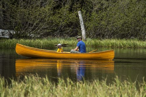 Chris Detrick  |  The Salt Lake Tribune
A familiy boats around looking at nature and wildlife during Kid's Day at Silver Lake at the top of Big Cottonwood Canyon Saturday June 21, 2014.