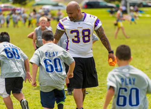 Trent Nelson  |  The Salt Lake Tribune
Naufahu Tahi runs drills as retired and current NFL players stage a training session as part of the NFL Play 60 program, in Layton, Friday June 20, 2014.