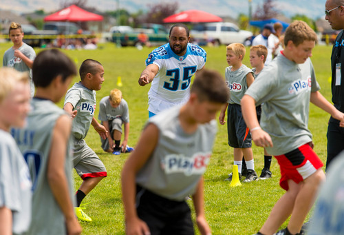 Trent Nelson  |  The Salt Lake Tribune
Quinton Ganther runs drills as retired and current NFL players stage a training session as part of the NFL Play 60 program, in Layton, Friday June 20, 2014.