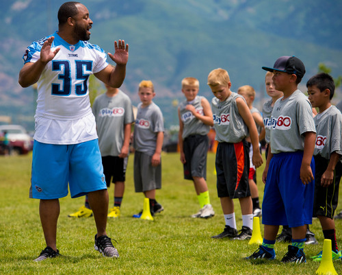 Trent Nelson  |  The Salt Lake Tribune
Quinton Ganther runs drills as retired and current NFL players stage a training session as part of the NFL Play 60 program, in Layton, Friday June 20, 2014.