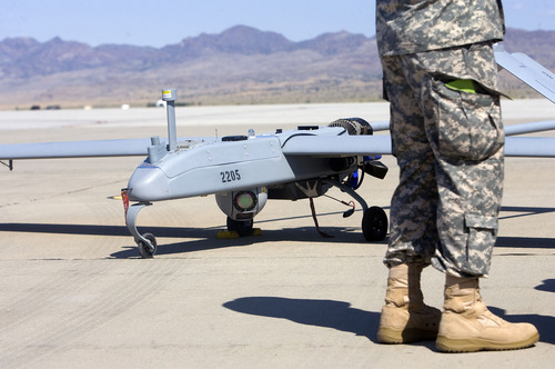AAl Hartmann  |  The Salt Lake Tribune
Aircraft of the Unmanned System Integration Capability (MUSIC) was demonstrated at Dugway Proving Grounds Thursday Sepetmeber 15.   Soldier's boots give scale to the size of the Shadow .