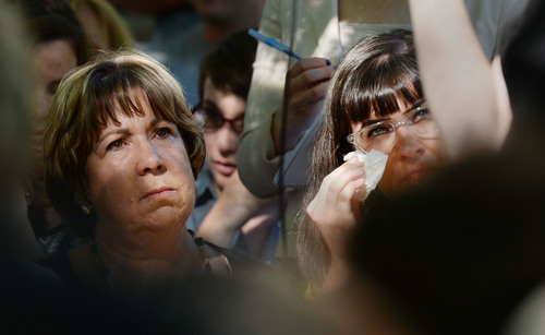 Steve Griffin  |  The Salt Lake Tribune


Kate Kelly, right, founder of the The Ordain Women organization, wipes tears from her eyes as she stands with her mother Donna Kelly, during a vigil at City Creek Park, in Salt Lake City, Utah Sunday, June 22, 2014.  The event coincided with the church disciplinary court underway at Kate's former stake center in Virginia. Kate no longer lives in Virginia, and is living in Utah before she moves to Kenya with her husband..