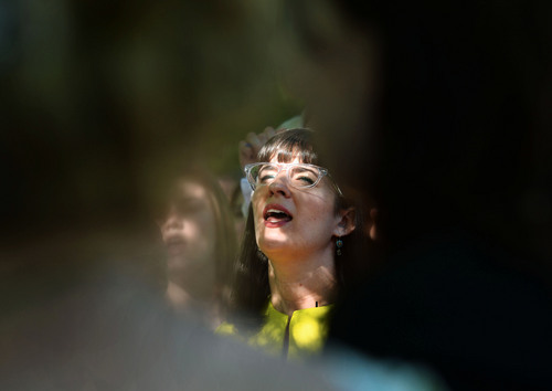 Steve Griffin  |  The Salt Lake Tribune


Kate Kelly, founder of the The Ordain Women organization, sings a hymn durring a vigil at City Creek Park, in Salt Lake City, Utah Sunday, June 22, 2014.  The event coincided with the church disciplinary court underway at Kate's former stake center in Virginia. Kate no longer lives in Virginia, and is living in Utah before she moves to Kenya with her husband..
