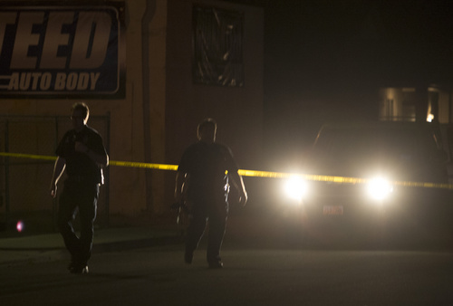 Rick Egan  |  The Salt Lake Tribune

South Salt Lake Police investigate a the scene of a homicide on Helm Ave, 3645 South State, where a man was found dead in a silver pick-up truck, Monday, June 23, 2014