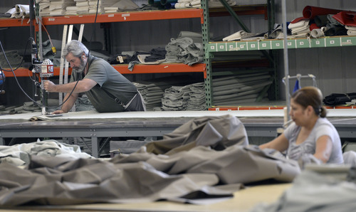 Al Hartmann  |  The Salt Lake Tribune I
Workers sew Springbar Tents at Kirkham Outdoors Product facility in Salt Lake City.   Zions Bank released their monthly consumer attitudes index at the sewing facility Tuesday June 24 and focused on the health of small retail businesses across the state.