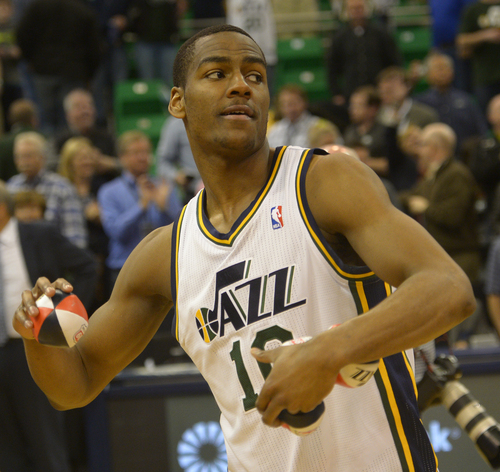 Rick Egan  |  The Salt Lake Tribune

Utah Jazz guard Alec Burks (10) tosses autographed basketballs in to the crowd, after the last home game of the season, at EnergySolutions Arena, Monday, April 14, 2014