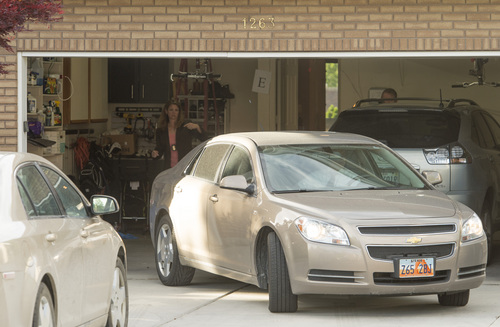 Rick Egan  |  The Salt Lake Tribune

FBI and local agents back a car into the garage of John Swallow's house during a search Monday, June 2, 2014