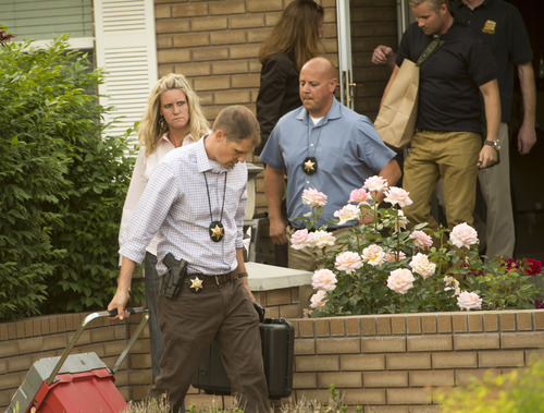 Rick Egan  |  The Salt Lake Tribune

FBI and state law enforcement agents leave John Swallow's residence in Sandy on Monday after searching the home for several hours. Monday, June 2, 2014