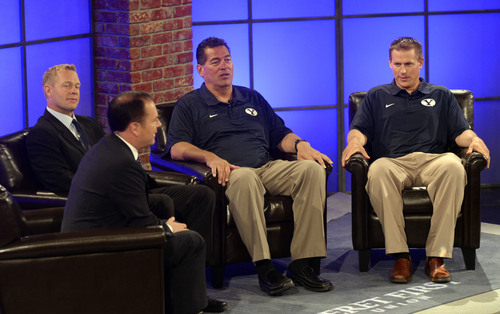 Al Hartmann  |  The Salt Lake Tribune 
KSL's Dave McCann, left front, interviews BYU head coach Bronco Mendenhall, offensive coordinator Robert Anae and defensive coordiantor Nick Howell on a live TV program on the state of the BYU football program for 2014 Monday June 23.