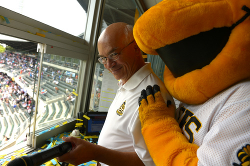 Leah Hogsten  |  The Salt Lake Tribune
After singing "Take Me Out To The Ballgame" acapella  during the 7th inning stretch, announcer Steve Klauke is peppered confetti when Buzz the mascot fires at him. Salt Lake Bees announcer Steve Klauke celebrates his 3,000th game, Tuesday, June 24, 2014, calling the Bee's game for SLC's Pacfic Coast League franchise. Klauke has the distinction of calling the most games a broadcaster has ever called for a single sports team in Utah history.