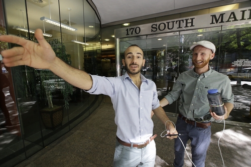 Plaintiffs Moudi Sbeity, left, and his partner Derek Kitchen, one of three couples who brought a lawsuit against Utah's gay marriage ban, celebrate as they arrive at their lawyer's office in Salt Lake City on Wednesday, June 25, 2014. A federal appeals court on Wednesday ruled for the first time that states must allow gay couples to marry, finding the Constitution protects same-sex relationships and putting a remarkable legal winning streak across the country one step closer to the U.S. Supreme Court. (AP Photo/Rick Bowmer)