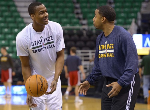 Leah Hogsten  |  The Salt Lake Tribune Utah Jazz point guard Alec Burks (10) warms up on the court with team assistant Johnnie Bryant prior to their matchup against the Cleveland Cavaliers, Friday, January 10, 2014 at Energy Solutions Arena. Gordon Hayward will not play due to a hip injury.