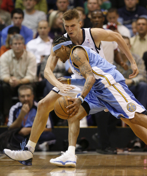Salt Lake City - Utah Jazz forward Andrei Kirilenko (47), of Russia, tries to steal the ball from Denver Nuggets guard Allen Iverson (3) during the Jazz NBA home opener against the Denver Nuggets at EnergySolutinos Arena Oct. 29, 2008.  Steve Griffin/The Salt Lake Tribune 10/29/08