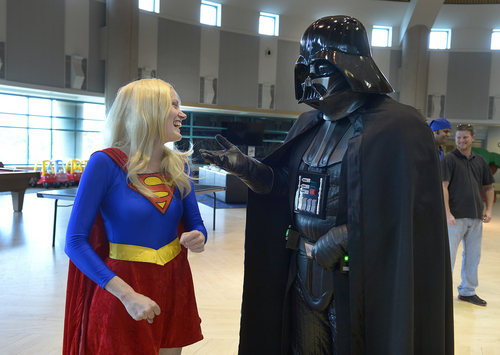 Scott Sommerdorf   |  The Salt Lake Tribune
Super Woman, (Heidi Mason), laughs after Darth Vader (Jared Peters) jokingly asked her if she wanted to join the "dark side" as costumed characters visited children at Shriner's Hospital, Thursday, June 25, 2014. The visit is in preparation for FantasyCon's "Night of Dreams" - a special preview event only July 2 for families associated with eight local charities that serve special needs and critically ill children.