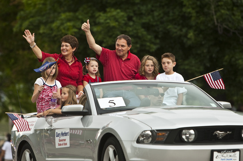 Photo by Chris Detrick | The Salt Lake Tribune 
Governor Gary Herbert and his family during the Provo Freedom Festival Parade Monday July 4, 2011.