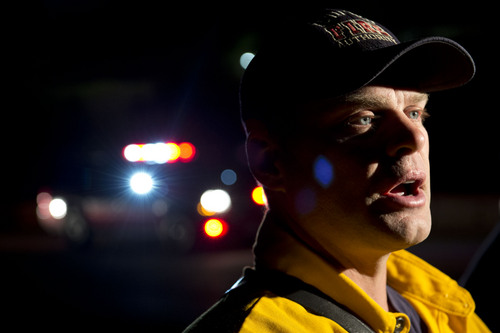 Jeremy Harmon  |  The Salt Lake Tribune

Unified Fire Battalion Chief Brian Anderton talks about a fire as it burns just south of RioTinto's smelter near Magna in the early morning hours of June 26, 2014. 55 firefighters were working to contain the blaze.
