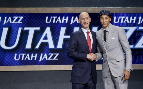 Dante Exum, right, poses for a photo with NBA Commissioner Adam Silver after being selected by the Utah Jazz as the fifth overall pick during the 2014 NBA draft, Thursday, June 26, 2014, in New York. (AP Photo/Kathy Willens)