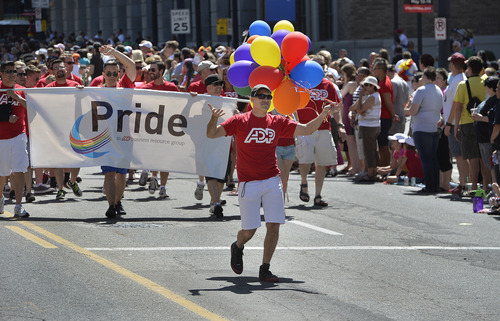Scott Sommerdorf   |  The Salt Lake Tribune
ADP marches in the Salt Lake City Pride Parade, Sunday, June 7, 2014.
