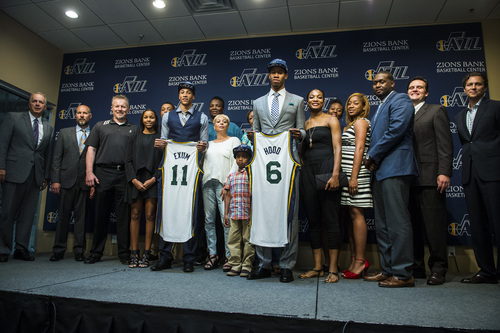 Chris Detrick  |  The Salt Lake Tribune
Utah Jazz's Dante Exum and Rodney Hood pose for pictures with members of their family during a press conference at the Zions Bank Basketball Center Friday June 27, 2014.