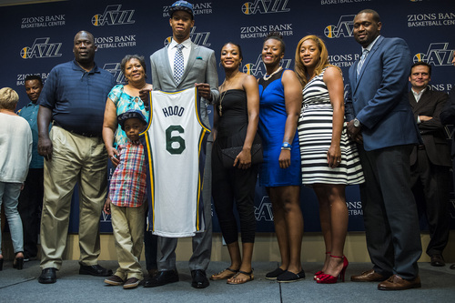 Chris Detrick  |  The Salt Lake Tribune
Utah Jazz's Rodney Hood poses for pictures with members of his family during a press conference at the Zions Bank Basketball Center Friday June 27, 2014.