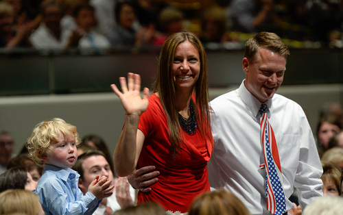 Francisco Kjolseth  |  The Salt Lake Tribune
Olympic medalist Noelle Pikus-Pace, alongside her son Traycen and husband Janson are honored during the Provo Freedom Festival's Patriotic Service at the Marriott Center on the BYU campus on Sunday, June 29, 2014.