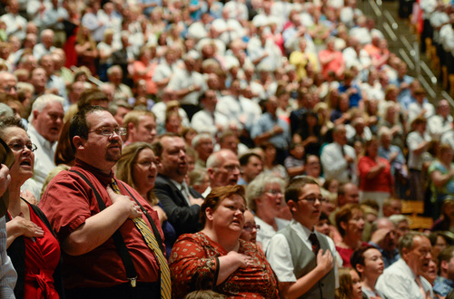 Francisco Kjolseth  |  The Salt Lake Tribune
Frederick Sperry, bottom left, joins in the pledge of allegiance during the Provo Freedom Festival's Patriotic Service at the Marriott Center on the BYU campus on Sunday, June 29, 2014.
